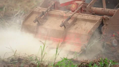 Slow motion tractor plowing soil in farm agriculture, preparation for seeding pl Stock Footage 145547201