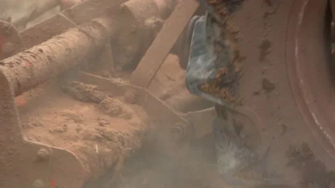 Slow motion tractor plowing soil land of farm agriculture  Stockbeeldmateriaal 147188072