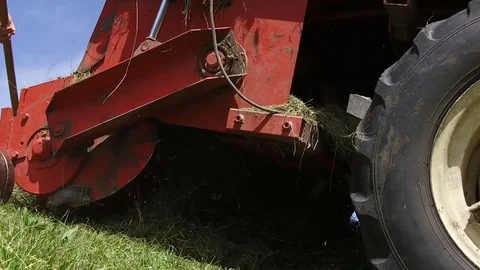 Slow motion tractor wheel collecting hay, Alta Badia Stock-Footage 79258083