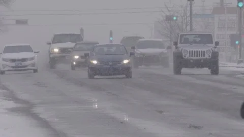 Slow Motion Traffic During Snow Storm Stock Footage 103374521