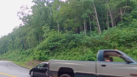 Slow motion of traffic on the mountain roads of Helen Georgia Stock Footage 149260975