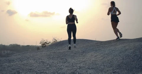SLOW MOTION, Trail Running partners friends goal successful in the rock mountain Stock Footage 124387651
