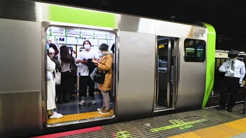 Slow motion of Train conductor on JR Yamanote Line checking the time  Stock-Footage 191828407