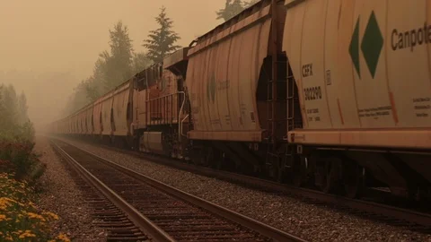 Slow motion train emerging from smoke with sound Stock Footage 94135444