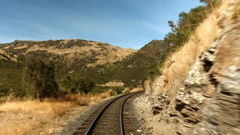 Slow motion train entering tunnel rear view Stock Footage 88381301