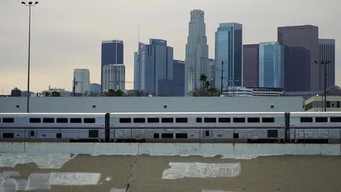 Slow motion of train in Los Angeles downtown cityscape skyline. Concept of urban Stock Footage 108810180
