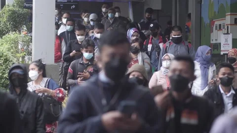 Slow motion Train passengers wearing protective masks walk Stock Footage 171521546
