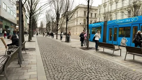 Slow Motion Of The Tram Leaving The Stop. European Public Transport. Stock Footage 265768528