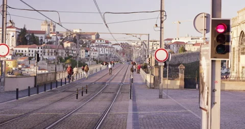 Slow motion of tram tracks running through city with people waiting on stops Stock Footage 155256058