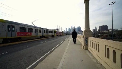 Slow motion of tram train driving to downtown cityscape Los Angeles, California. Stock Footage 108810114