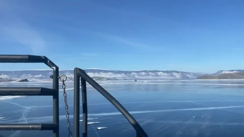 Slow motion. a trip through the frozen lake Baikal on a hovercraft. winter Baika Stock Footage 273374595