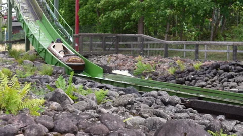 Slow Motion of Tukkijoki log raft ride at Särkänniemi amusement park Stock Footage 336975418