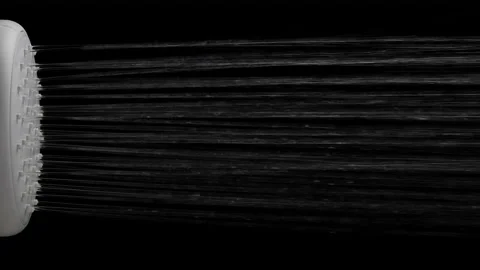 Slow motion of turned on water quickly running from a shower head. Isolated on Vídeo Stock 234136535