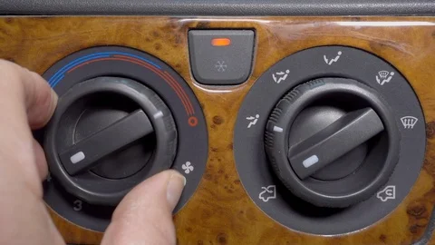 Slow motion: Turning on and adjusting car air conditioning. Stock-Footage 91542430