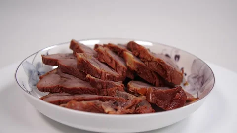 Slow motion turning pot-stewed meat Stock Footage 169073066