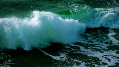 Slow motion of Turquoise waves in ocean Breaking wave with sun light Abstract Video stock 336585761