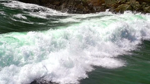 Slow motion of Turquoise waves in ocean Breaking wave with sun light Abstract Stock-Footage 336585802