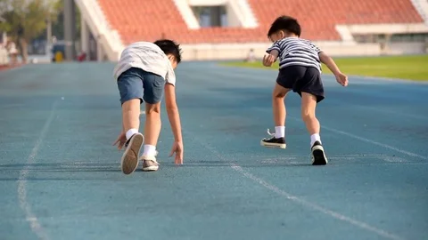 Slow motion two boy running together Stock Footage 72882820