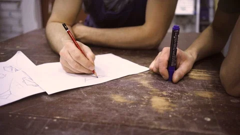 Slow Motion: Two carpenters discuss drawing (round wood) in the workshop Stock Footage 102567096