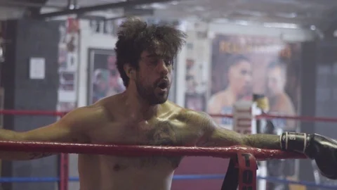 Slow Motion Two Exhausted Athletic Men Hug in Boxing Gym Stock Footage 125284820