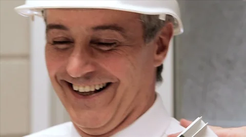 Slow motion of two men joking around at work. Stock Footage 88407188