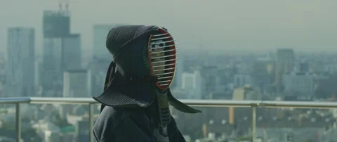Slow motion of two men practising kendo with wooden katana sword on roof, Tokyo Stock Footage 136121688