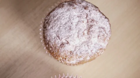 Slow motion two muffins on the table and a cup of coffee Stock Footage 88822761