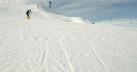 Slow Motion Of Two People Racing While Skiing Stock Footage 140189986