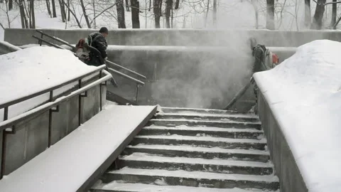 Slow motion of two workers with special machines remove snow Vidéo 233520994