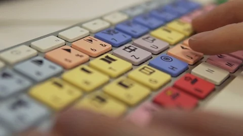 Slow Motion: Typing and Coding on Editing Keyboard with Colorful Buttons Stock Footage 124658319