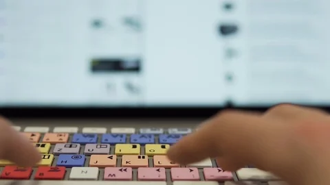 Slow Motion: Typing on Editing Keyboard in Front of Modern Display Stock Footage 124658313