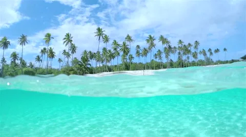 SLOW MOTION UNDERWATER: Amazing tropical island and turquoise ocean lagoon Stock Footage 60926022