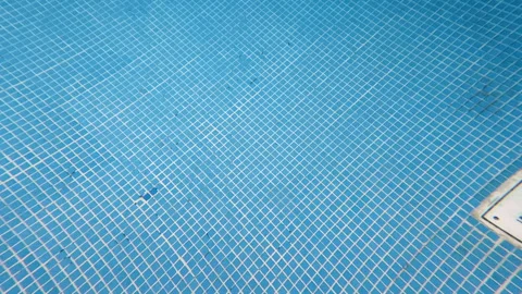 Slow Motion Underwater Camera Movement Across Swimming Pool Tiles 動画素材 342323767
