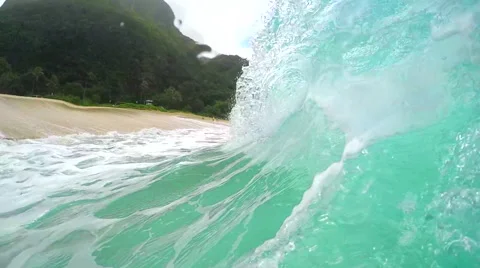 SLOW MOTION UNDERWATER: Emerald wave breaking on sandy seabed at Hawaii island Stock Footage 64447829