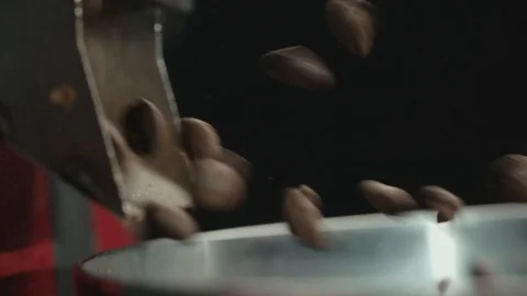 Slow motion, unloading freshly roasted coffee and mixing roasted coffee Stock-Footage 88745693