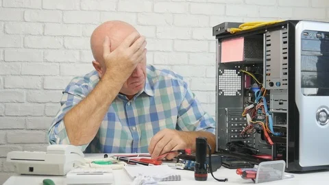 Slow Motion with Upset and Disappointed Engineer Fixing Hardware Problems Stock Footage 104209486