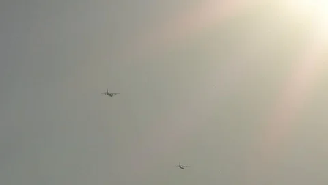 Slow-motion: US Air Force (USAF) military aircraft flying in sunlight, clear sky Stock Footage 111785504