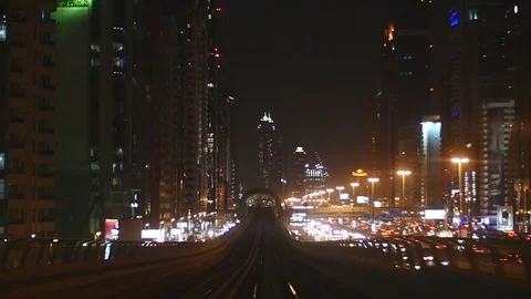 Slow motion variation of Dubai Metro's POV through the city nightscape. P2 Stock Footage 83671255