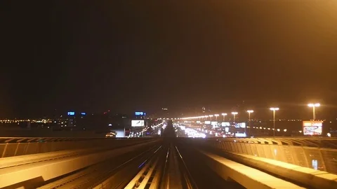 Slow motion variation of Dubai Metro's POV through the city nightscape. P4 Stock Footage 83671414
