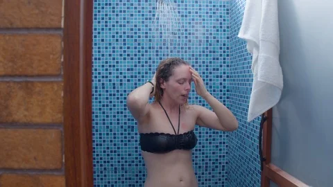 Slow motion of various tourists bathing in contiguous showers at a spa Video stock 119801615