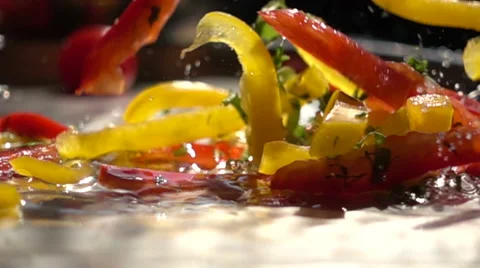 Slow motion vegetable mix falls into the water Stock Footage 68673049
