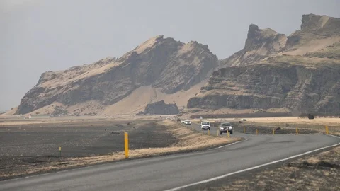 Slow Motion of Vehicles Driving Down Highway Near Iceland Skogafoss Waterfall, Stock Footage 97478063