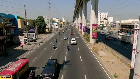 Slow Motion Vehicles Passing the Main Highway Bound to Antipolo City Stock Footage 236591606