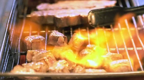 Slow motion of a Vendor cooking a beef meat with blowtorch in Night market-Dan Stock Footage 68459287