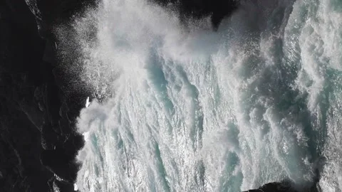 Slow motion. vertical composition. Bright blue waves break into white foam on Video stock 259538663