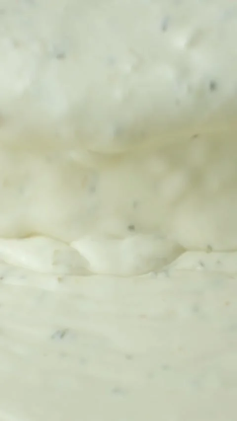 Slow motion vertical shooting of the flow of natural traditional tartar sauce Stock Footage 340549915