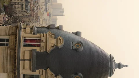 Slow-motion vertical shot of a building's spire in downtown Paris, France Video stock 249258212