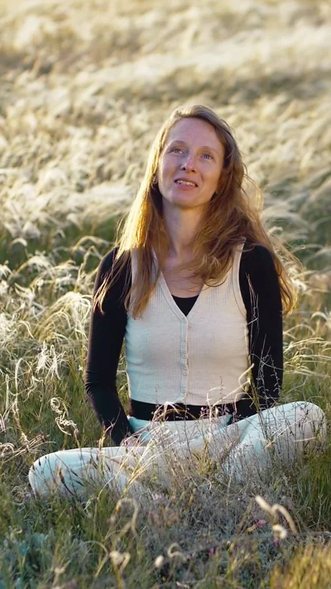 Slow motion vertical video close up. Portrait A woman rests and smiles sitting Video stock 241650619