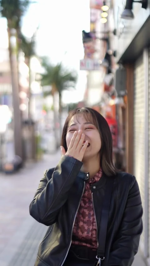 Slow-motion vertical video of a young Japanese woman Stock Footage 270189076