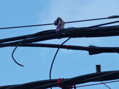 Slow motion video of applying heat to shrink a joint on twisted aerial. Stock Footage 345128865